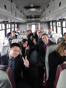 Rotman career trek students sitting on a bus en-route to their next company visit